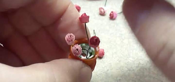 adding quilled paper miniature flowers